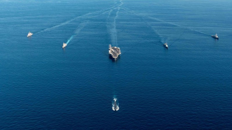 FILE - U.S. aircraft carrier USS Ronald Reagan is escorted into port in Busan, South Korea on Sept. 23, 2022. North Korea launched two short-range ballistic missiles toward its eastern waters Thursday, Oct. 6, 2022. Thursday’s launches came as the U.S. aircraft carrier USS Ronald Reagan returned to waters east of South Korea in what South Korea’s military called an attempt to demonstrate the allies’ 