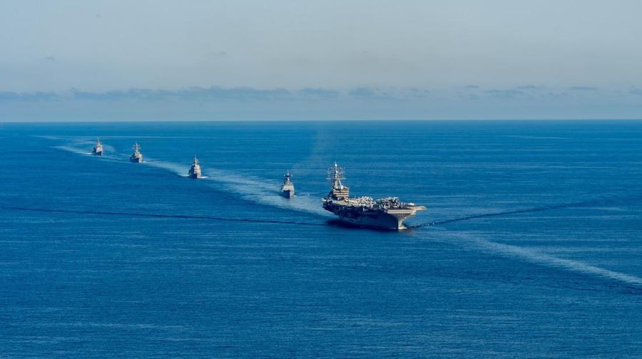 FILE - U.S. aircraft carrier USS Ronald Reagan is escorted into port in Busan, South Korea on Sept. 23, 2022. North Korea launched two short-range ballistic missiles toward its eastern waters Thursday, Oct. 6, 2022. Thursday’s launches came as the U.S. aircraft carrier USS Ronald Reagan returned to waters east of South Korea in what South Korea’s military called an attempt to demonstrate the allies’ 