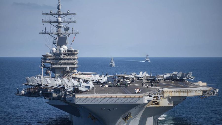 FILE - U.S. aircraft carrier USS Ronald Reagan is escorted into port in Busan, South Korea on Sept. 23, 2022. North Korea launched two short-range ballistic missiles toward its eastern waters Thursday, Oct. 6, 2022. Thursday’s launches came as the U.S. aircraft carrier USS Ronald Reagan returned to waters east of South Korea in what South Korea’s military called an attempt to demonstrate the allies’ 