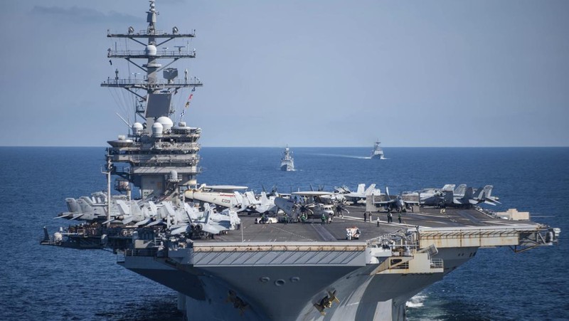 FILE - U.S. aircraft carrier USS Ronald Reagan is escorted into port in Busan, South Korea on Sept. 23, 2022. North Korea launched two short-range ballistic missiles toward its eastern waters Thursday, Oct. 6, 2022. Thursday’s launches came as the U.S. aircraft carrier USS Ronald Reagan returned to waters east of South Korea in what South Korea’s military called an attempt to demonstrate the allies’ 