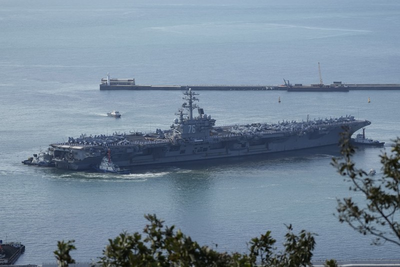 South Korea Koreas Tensions FILE - U.S. aircraft carrier USS Ronald Reagan is escorted into port in Busan, South Korea on Sept. 23, 2022. North Korea launched two short-range ballistic missiles toward its eastern waters Thursday, Oct. 6, 2022. Thursday’s launches came as the U.S. aircraft carrier USS Ronald Reagan returned to waters east of South Korea in what South Korea’s military called an attempt to demonstrate the allies’