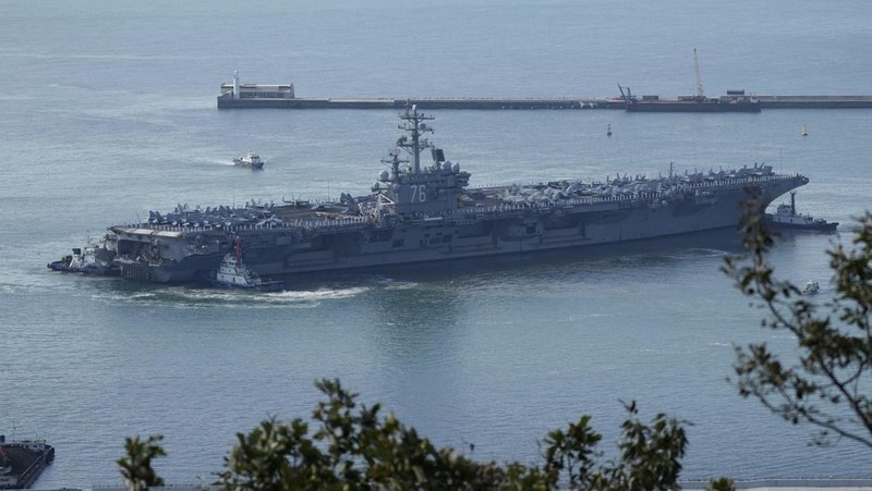 FILE - U.S. aircraft carrier USS Ronald Reagan is escorted into port in Busan, South Korea on Sept. 23, 2022. North Korea launched two short-range ballistic missiles toward its eastern waters Thursday, Oct. 6, 2022. Thursday’s launches came as the U.S. aircraft carrier USS Ronald Reagan returned to waters east of South Korea in what South Korea’s military called an attempt to demonstrate the allies’ 