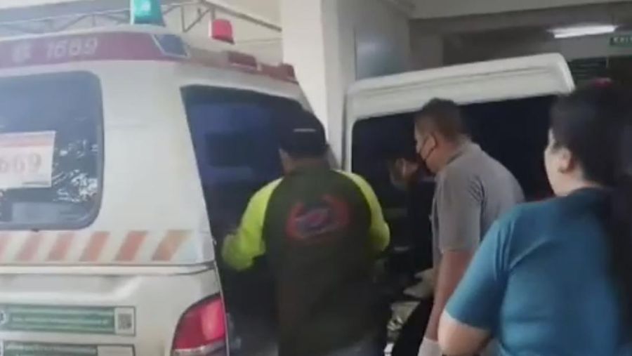 In this image taken from video, officials enter the site of an attack at a daycare canter, Thursday, Oct. 6, 2022, in the town of Nongbua Lamphu, north eastern Thailand. More than 30 people, primarily children, were killed Thursday when a gunman opened fire the childcare center authorities said. (TPBS via AP)