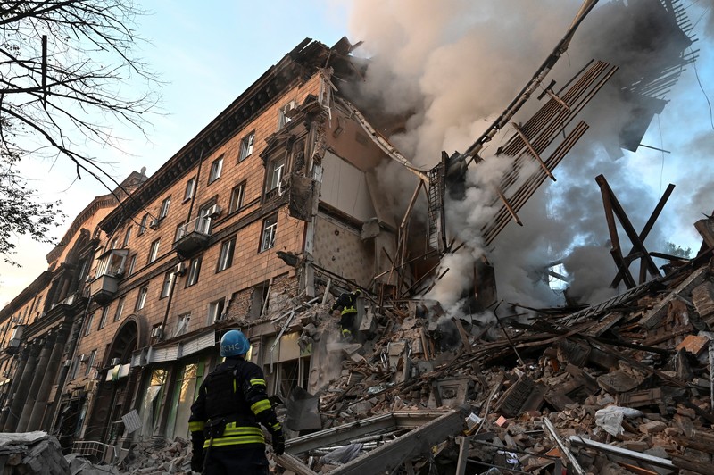 UKRAINE-CRISIS/ZAPORIZHZHIA A rescuer works at the site of a residential building heavily damaged by a Russian missile strike, amid their attack on Ukraine, in Zaporizhzhia, Ukraine October 6, 2022. REUTERS/Stringer