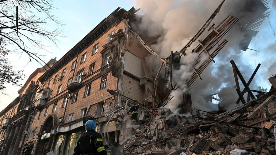 A rescuer works at the site of a residential building heavily damaged by a Russian missile strike, amid their attack on Ukraine, in Zaporizhzhia, Ukraine October 6, 2022.  REUTERS/Stringer