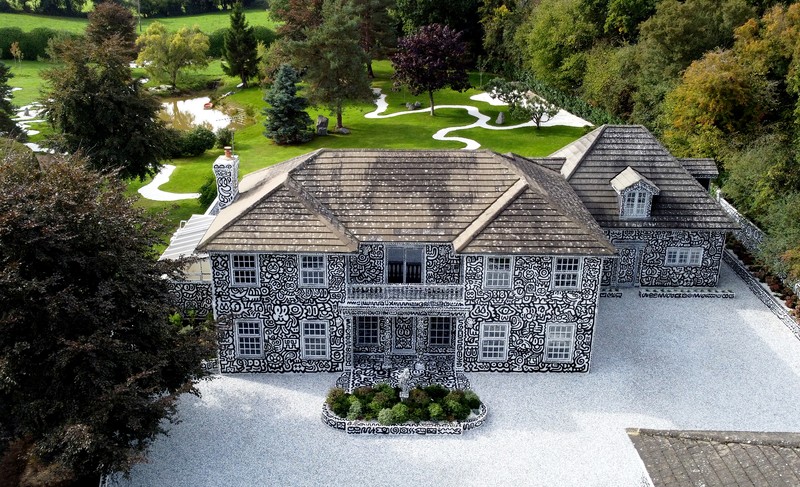 A view of the outside of British artists' Sam Cox, aka Mr Doodle, as he reveals the Doodle House, a twelve-room mansion at Tenterden, in Kent, which has been covered, inside and out in the artist's trademark monochrome, cartoonish hand-drawn doodles. Picture date: Monday October 3, 2022. (Photo by Gareth Fuller/PA Images via Getty Images)