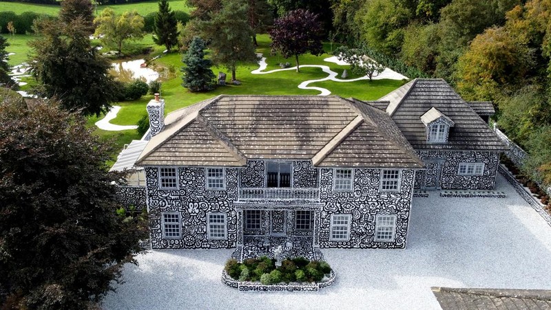 A view of the outside of British artists' Sam Cox, aka Mr Doodle, as he reveals the Doodle House, a twelve-room mansion at Tenterden, in Kent, which has been covered, inside and out in the artist's trademark monochrome, cartoonish hand-drawn doodles. Picture date: Monday October 3, 2022. (Photo by Gareth Fuller/PA Images via Getty Images)