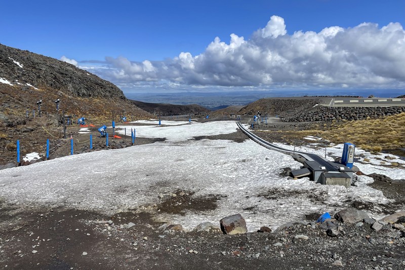 New Zealand Ski Troubles Skiers make the most of the very little snow at the Tūroa ski field, on Mt Ruapehu, New Zealand on Sept. 22, 2022. A disastrous snow season has left two of New Zealand's largest ski fields on the brink of bankruptcy, with climate change appearing to play a significant role. (AP Photo/Nick Perry)
