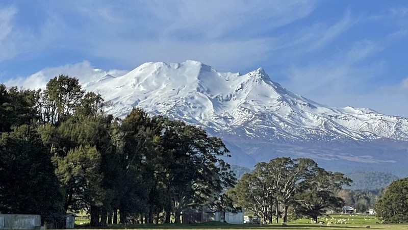 Skiers make the most of the very little snow at the Tūroa ski field, on Mt Ruapehu, New Zealand on Sept. 22, 2022. A disastrous snow season has left two of New Zealand's largest ski fields on the brink of bankruptcy, with climate change appearing to play a significant role. (AP Photo/Nick Perry)