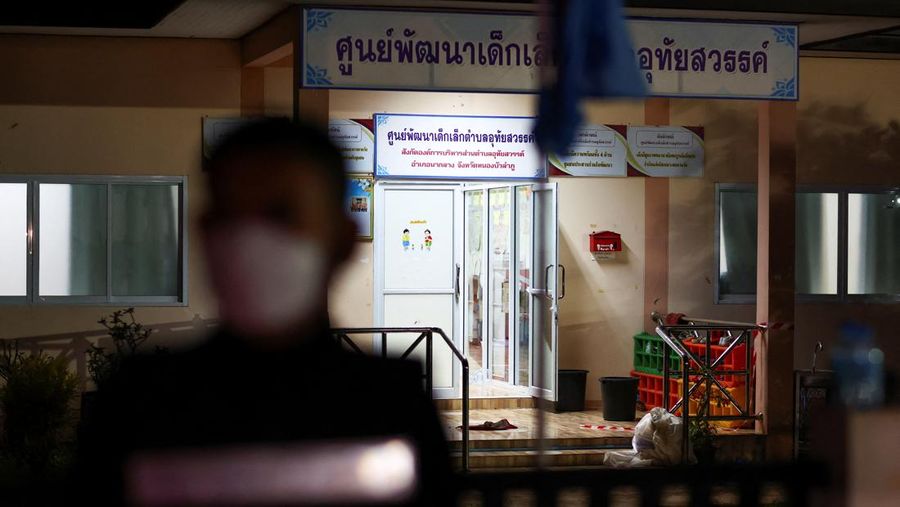 A police officer stands outside a day care center which was the scene of a mass shooting, in the town of Uthai Sawan, around 500 km northeast of Bangkok in the province of Nong Bua Lam Phu, Thailand October 6, 2022. REUTERS/Athit Perawongmetha