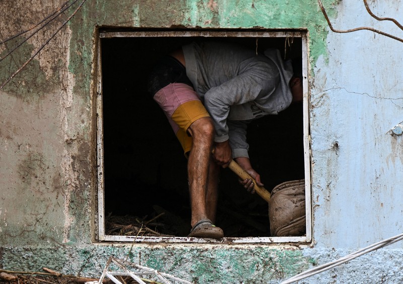 Tanah longsor terjadi di Venezuela setelah wilayah tersebut dilanda hujan deras. Sebanyak 22 orang dilaporkan tewas dan 52 orang lainnya masih hilang. (AFP via Getty Images/YURI CORTEZ)