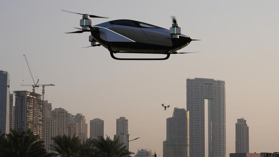 A XPeng X2, an electric flying taxi developed by the Guangzhou-based XPeng, Inc's aviation affiliate, is tested in front of the Marina District in Dubai, United Arab Emirates, Monday, Oct. 10, 2022. Monday’s demonstration was held with an empty cockpit, but the company says it carried out a manned flight test last year of the two-passenger vehicle. (AP Photo/Kamran Jebreili)