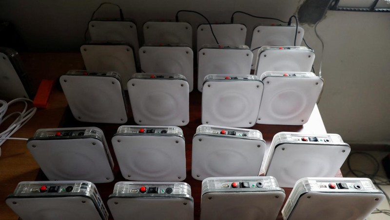An employee holds a handful of lithium-ion cells from old laptop battery packs at the Quadloop recycling facility in Lagos, Nigeria October 4, 2022. REUTERS/Temilade Adelaja