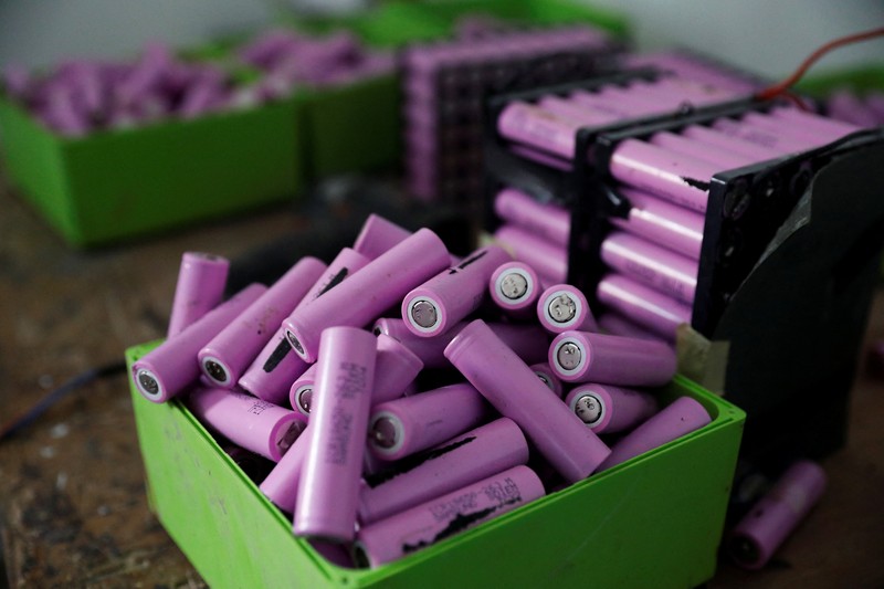 NIGERIA-SOLAR/WASTE An employee holds a handful of lithium-ion cells from old laptop battery packs at the Quadloop recycling facility in Lagos, Nigeria October 4, 2022. REUTERS/Temilade Adelaja