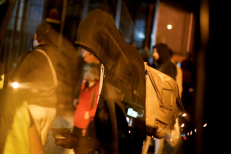 People wait in line to collect food from homeless charity CASA in central Lisbon, Portugal October 11, 2022. REUTERS/Pedro Nunes