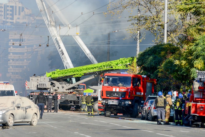 Rescuers work to clear the rubble of a residential building destroyed by a ''kamikaze drone'' attack in downtown Kyiv, Ukriane, on October 17, 2022 (Photo by Oleg Pereverzev/NurPhoto via Getty Images)