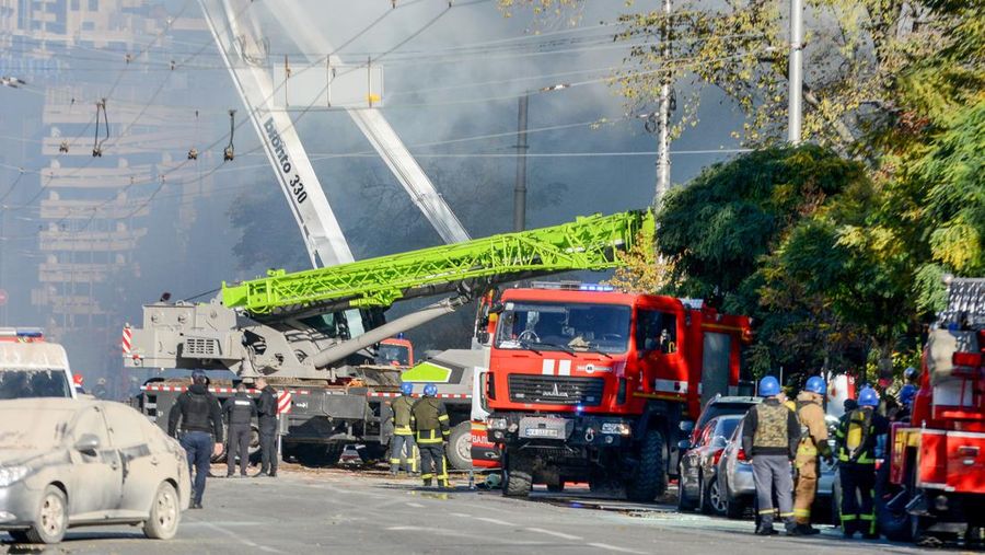 Rescuers work to clear the rubble of a residential building destroyed by a ''kamikaze drone'' attack in downtown Kyiv, Ukriane, on October 17, 2022 (Photo by Oleg Pereverzev/NurPhoto via Getty Images)