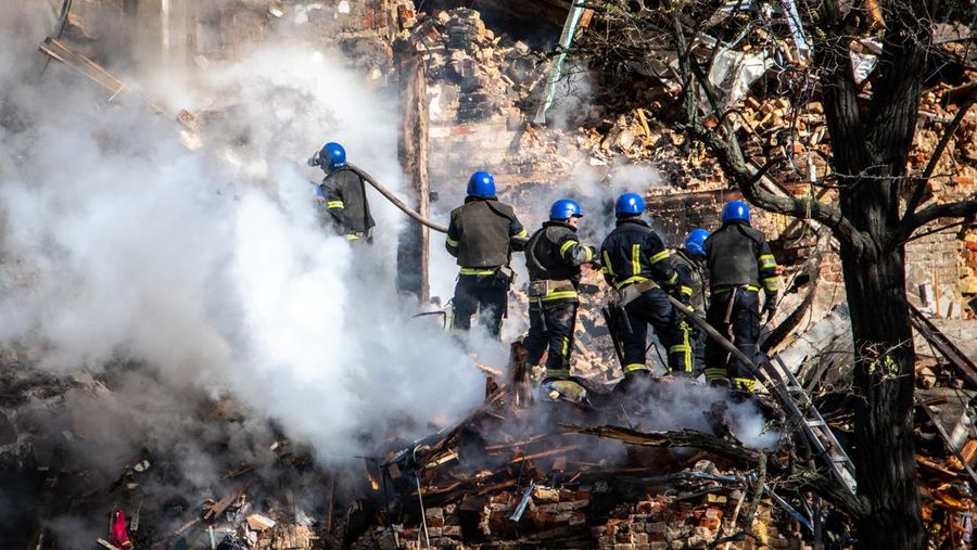 Rescuers work to clear the rubble of a residential building destroyed by a ''kamikaze drone'' attack in downtown Kyiv, Ukriane, on October 17, 2022 (Photo by Oleg Pereverzev/NurPhoto via Getty Images)