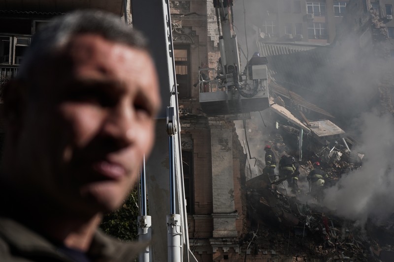 Rescuers work to clear the rubble of a residential building destroyed by a ''kamikaze drone'' attack in downtown Kyiv, Ukriane, on October 17, 2022 (Photo by Oleg Pereverzev/NurPhoto via Getty Images)