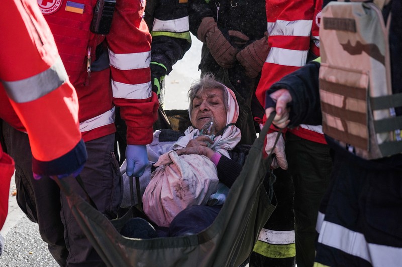 Rescuers work to clear the rubble of a residential building destroyed by a ''kamikaze drone'' attack in downtown Kyiv, Ukriane, on October 17, 2022 (Photo by Oleg Pereverzev/NurPhoto via Getty Images)