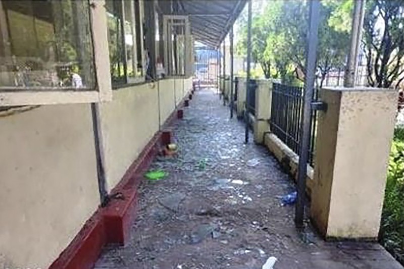 In this photo provided by the Military True News Information Team, a parcel-reception location at the entrance of the Insein prison sits damaged after an explosion Wednesday, Oct. 19, 2022, in Yangon, Myanmar. A bombing on Wednesday near the front gate of Myanmar’s main prison for political detainees killed a number people, including visitors and prison personnel, local media and the government said. (Military True News Information Team via AP)