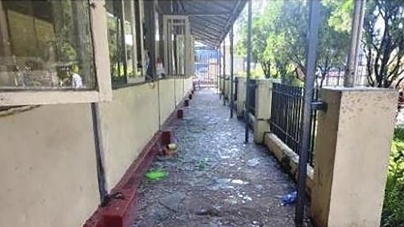 In this photo provided by the Military True News Information Team, a parcel-reception location at the entrance of the Insein prison sits damaged after an explosion Wednesday, Oct. 19, 2022, in Yangon, Myanmar. A bombing on Wednesday near the front gate of Myanmar’s main prison for political detainees killed a number people, including visitors and prison personnel, local media and the government said. (Military True News Information Team via AP)