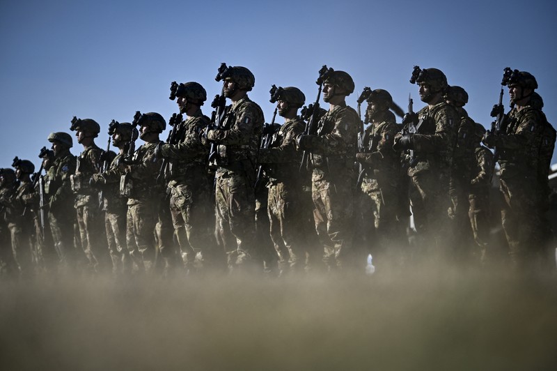 Italian soldiers stand in formation as they take part in the official ceremony marking Italy's becoming a framework nation for the NATO battle group on the territory of Bulgaria at Novo Selo military ground on October 17, 2022. (Photo by Nikolay DOYCHINOV / AFP) (Photo by NIKOLAY DOYCHINOV/AFP via Getty Images)