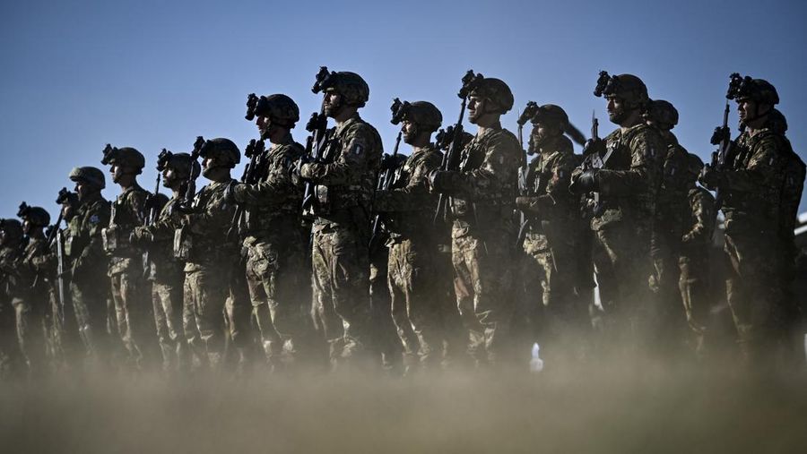 Italian soldiers stand in formation as they take part in the official ceremony marking Italy's becoming a framework nation for the NATO battle group on the territory of Bulgaria at Novo Selo military ground on October 17, 2022. (Photo by Nikolay DOYCHINOV / AFP) (Photo by NIKOLAY DOYCHINOV/AFP via Getty Images)