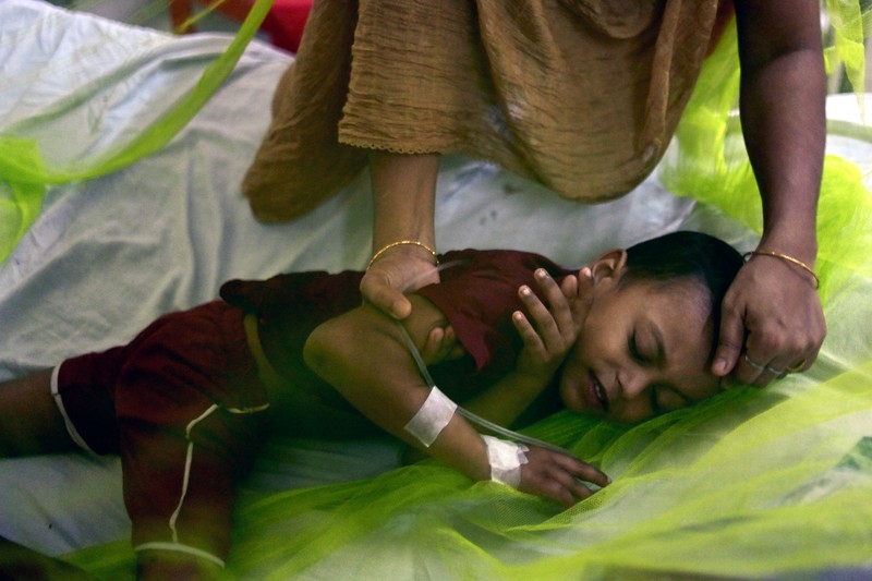 Children are kept inside mosquito nets as they are hospitalized due to dengue fever at Dhaka Child Hospital in Dhaka, Bangladesh on October 19, 2022.  Bangladesh logged its highest daily caseload of dengue fever on Tuesday, with 900 cases reported over the past 24 hours, raising the total tally to 26,938 in the country this year, according to the Media Report. (Photo by Syed Mahamudur Rahman/NurPhoto via Getty Images)
