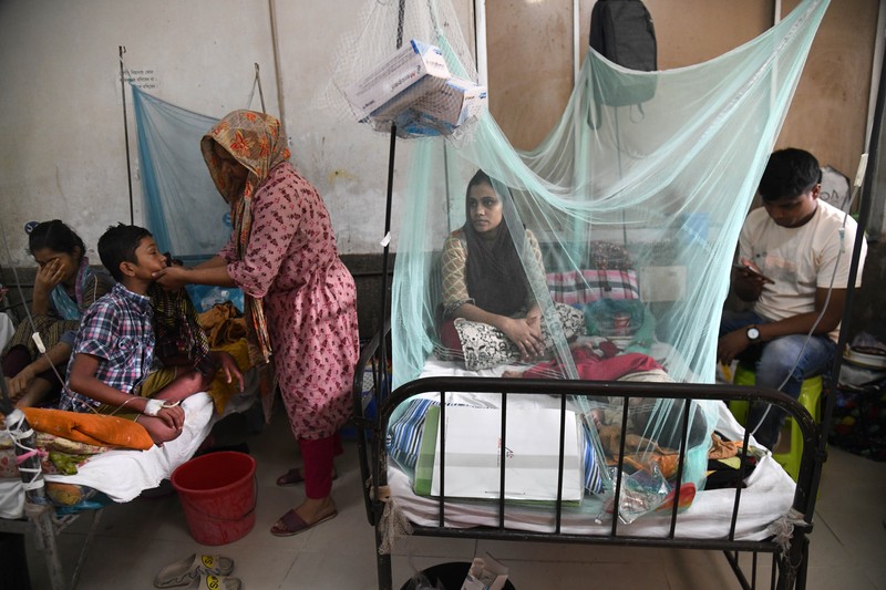 Children are kept inside mosquito nets as they are hospitalized due to dengue fever at Dhaka Child Hospital in Dhaka, Bangladesh on October 19, 2022.  Bangladesh logged its highest daily caseload of dengue fever on Tuesday, with 900 cases reported over the past 24 hours, raising the total tally to 26,938 in the country this year, according to the Media Report. (Photo by Syed Mahamudur Rahman/NurPhoto via Getty Images)