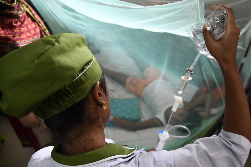 Children are kept inside mosquito nets as they are hospitalized due to dengue fever at Dhaka Child Hospital in Dhaka, Bangladesh on October 19, 2022.  Bangladesh logged its highest daily caseload of dengue fever on Tuesday, with 900 cases reported over the past 24 hours, raising the total tally to 26,938 in the country this year, according to the Media Report. (Photo by Syed Mahamudur Rahman/NurPhoto via Getty Images)