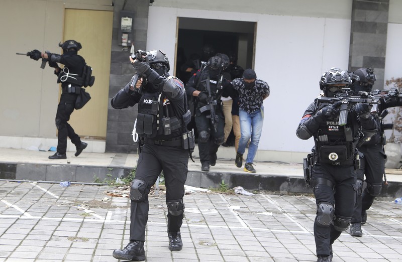 Special force members take part in an anti-terror security drill as part of preparations for the summit meeting of the G20 in Bali, Indonesia on Thursday, Oct. 20, 2022. (AP Photo/Firdia Lisnawati)