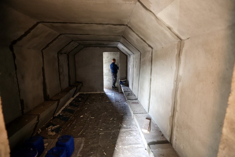 1244096129 KHARKIV, UKRAINE - OCTOBER 19, 2022 - Men are seen during the production of the components for a concrete bomb shelter, Kharkiv, norheastern Ukraine. (Photo credit should read Vyacheslav Madiyevskyi / Ukrinform/Future Publishing via Getty Images)