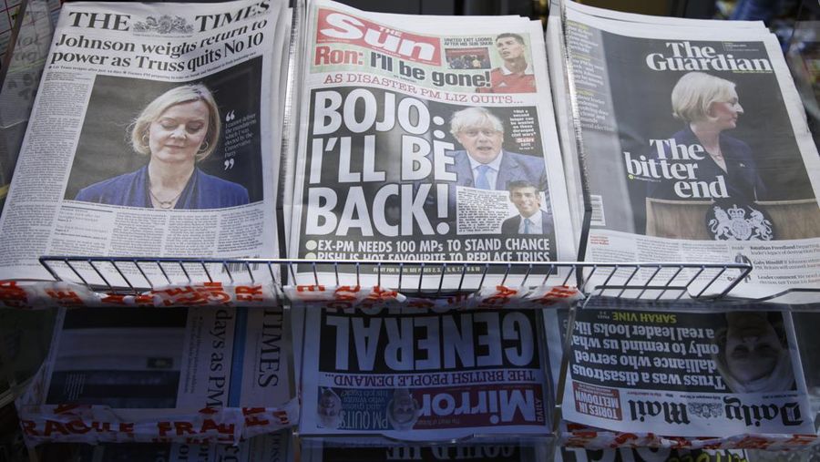 A selection of the front pages of British national newspapers showing the reaction the the resignation of Prime Minister Liz Truss, at a newsagents in central London, Friday, Oct. 21, 2022. British Prime Minister Liz Truss resigned Thursday, bowing to the inevitable after a tumultuous, short-lived term in which her policies triggered turmoil in financial markets and a rebellion in her party that obliterated her authority. (AP Photo/David Cliff)