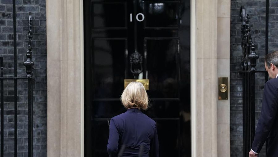 A bookmaker takes bets for the next British Prime Minister after Liz Truss resigned in London, Thursday, Oct. 20, 2022. Truss resigned Thursday, bowing to the inevitable after a tumultuous, short-lived term in which her policies triggered turmoil in financial markets and a rebellion in her party that obliterated her authority.(AP Photo/David Cliff)