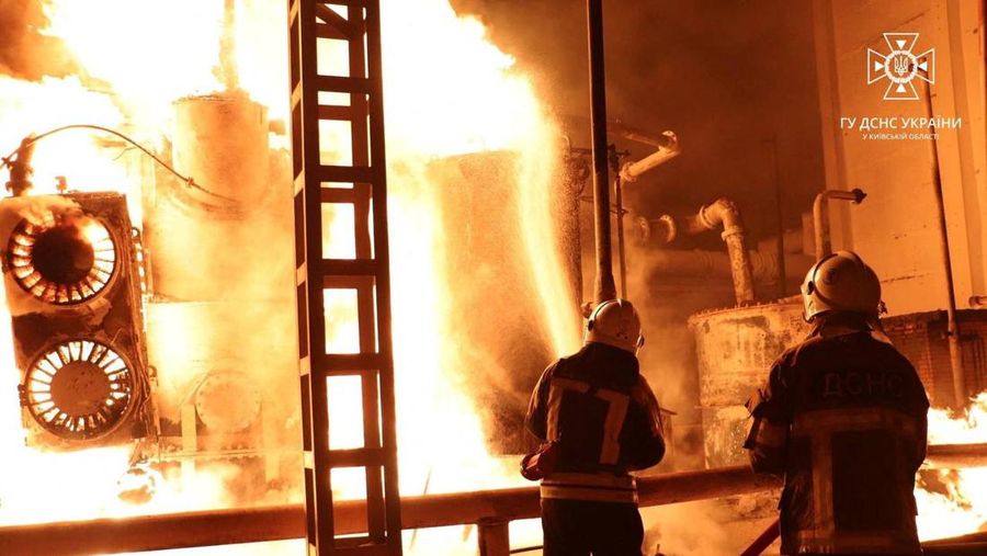 Firefighters work to put out a fire at energy infrastructure facilities, damaged by Russian drone strike, as Russia's attack on Ukraine continues, in undisclosed location, Ukraine October 27, 2022. State Emergency Service of Ukraine/Handout via REUTERS ATTENTION EDITORS - THIS IMAGE HAS BEEN SUPPLIED BY A THIRD PARTY. MANDATORY CREDIT.