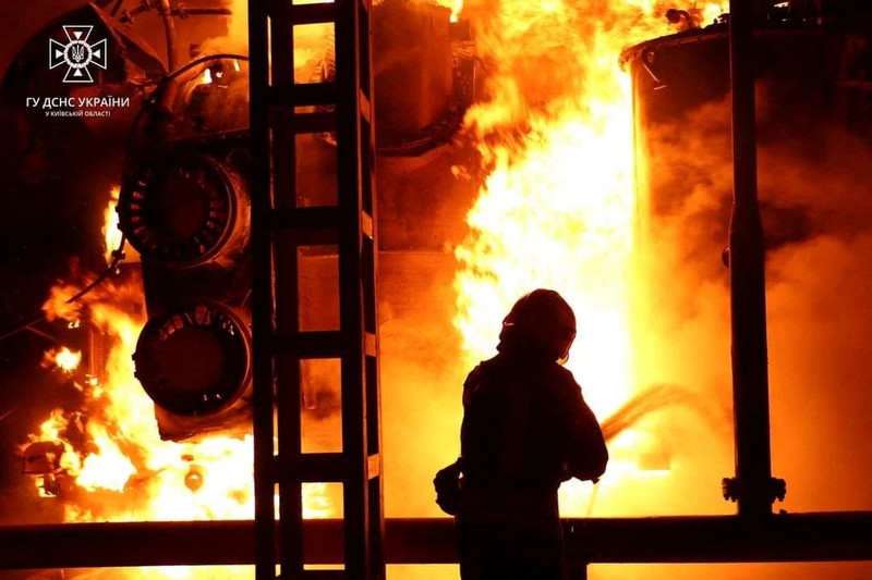 UKRAINE-CRISIS/KYIV Firefighters work to put out a fire at energy infrastructure facilities, damaged by Russian drone strike, as Russia's attack on Ukraine continues, in undisclosed location, Ukraine October 27, 2022. State Emergency Service of Ukraine/Handout via REUTERS ATTENTION EDITORS - THIS IMAGE HAS BEEN SUPPLIED BY A THIRD PARTY. MANDATORY CREDIT.