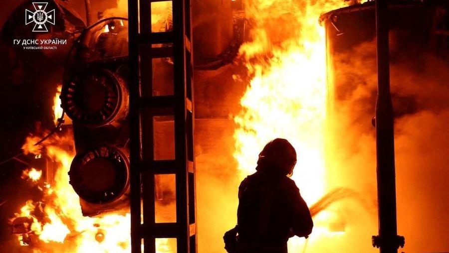 Firefighters work to put out a fire at energy infrastructure facilities, damaged by Russian drone strike, as Russia's attack on Ukraine continues, in undisclosed location, Ukraine October 27, 2022.  State Emergency Service of Ukraine/Handout via REUTERS    ATTENTION EDITORS -  THIS IMAGE HAS BEEN SUPPLIED BY A THIRD PARTY. MANDATORY CREDIT.
