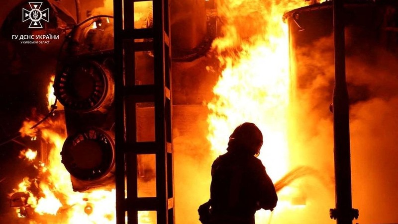 Firefighters work to put out a fire at energy infrastructure facilities, damaged by Russian drone strike, as Russia's attack on Ukraine continues, in undisclosed location, Ukraine October 27, 2022.  State Emergency Service of Ukraine/Handout via REUTERS    ATTENTION EDITORS -  THIS IMAGE HAS BEEN SUPPLIED BY A THIRD PARTY. MANDATORY CREDIT.