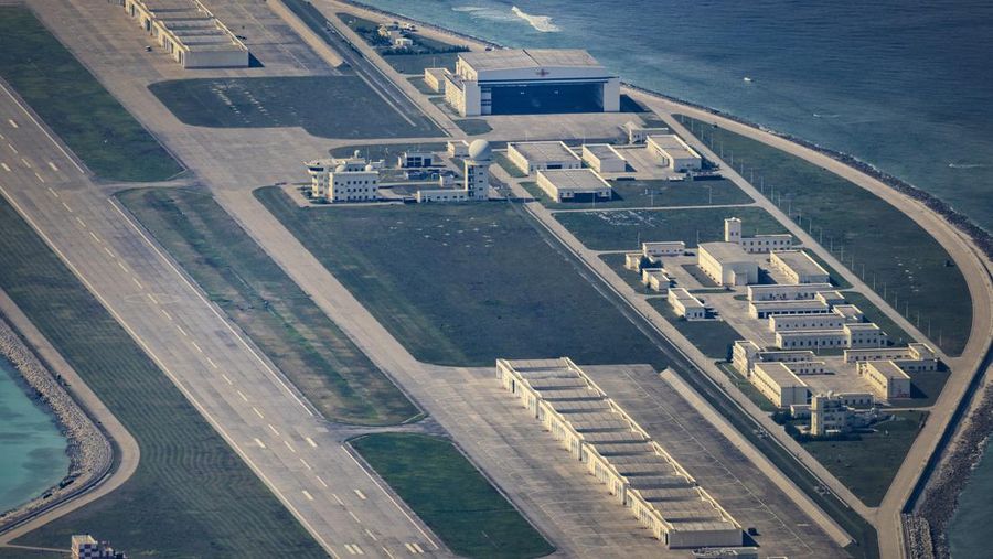 SPRATLY ISLANDS, AT SEA - OCTOBER 25: An airfield, buildings, and structures are seen on the artificial island built by China in Subi Reef on October 25, 2022 in Spratly Islands, South China Sea. China has progressively asserted its claim of ownership over disputed islands in the South China Sea by artificially increasing the size of islands, creating new islands and building ports, military outposts and airstrips. The South China sea is an important trade route and is of significant interest as geopolitical tensions remain high in the region. (Photo by Ezra Acayan/Getty Images)