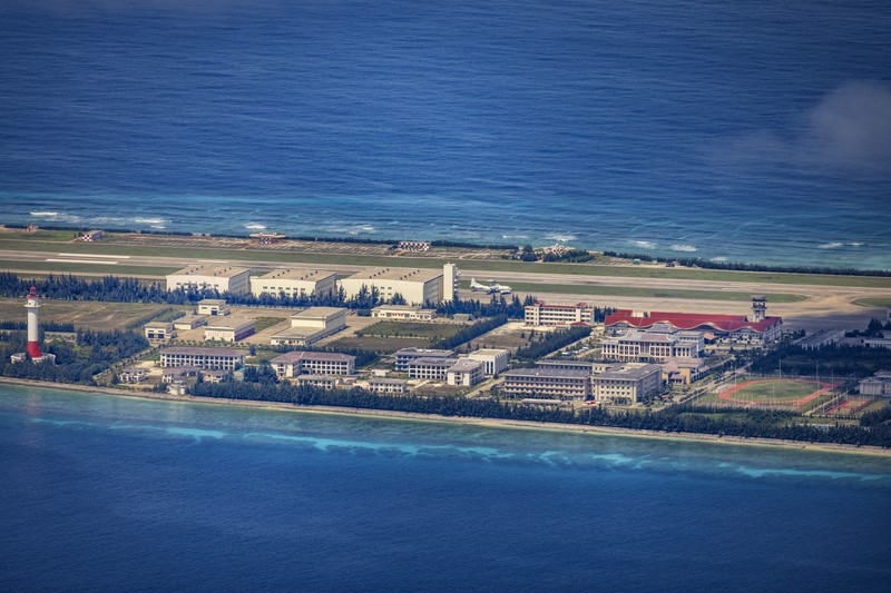 SPRATLY ISLANDS, AT SEA - OCTOBER 25: Buildings and structures are seen on the artificial island built by China in Gaven Reefs on October 25, 2022 in Spratly Islands, South China Sea. China has progressively asserted its claim of ownership over disputed islands in the South China Sea by artificially increasing the size of islands, creating new islands and building ports, military outposts and airstrips. The South China sea is an important trade route and is of significant interest as geopolitical tensions remain high in the region. (Photo by Ezra Acayan/Getty Images)