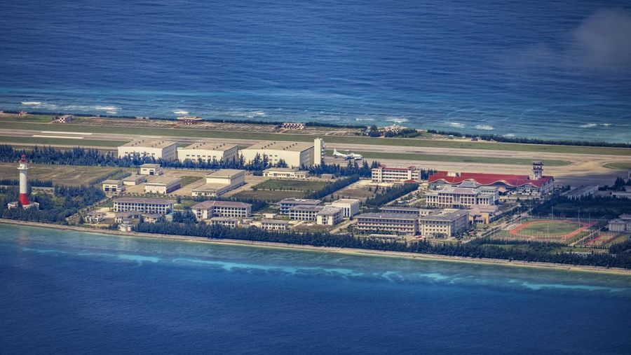 SPRATLY ISLANDS, AT SEA - OCTOBER 25: Buildings and structures are seen on the artificial island built by China in Gaven Reefs on October 25, 2022 in Spratly Islands, South China Sea. China has progressively asserted its claim of ownership over disputed islands in the South China Sea by artificially increasing the size of islands, creating new islands and building ports, military outposts and airstrips. The South China sea is an important trade route and is of significant interest as geopolitical tensions remain high in the region. (Photo by Ezra Acayan/Getty Images)