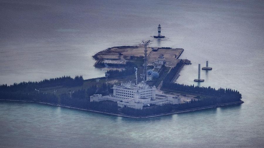 SPRATLY ISLANDS, AT SEA - OCTOBER 25: An airfield, buildings, and structures are seen on the artificial island built by China in Subi Reef on October 25, 2022 in Spratly Islands, South China Sea. China has progressively asserted its claim of ownership over disputed islands in the South China Sea by artificially increasing the size of islands, creating new islands and building ports, military outposts and airstrips. The South China sea is an important trade route and is of significant interest as geopolitical tensions remain high in the region. (Photo by Ezra Acayan/Getty Images)
