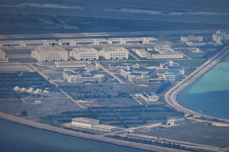 SPRATLY ISLANDS, AT SEA - OCTOBER 25: Buildings and structures are seen on the artificial island built by China in Gaven Reefs on October 25, 2022 in Spratly Islands, South China Sea. China has progressively asserted its claim of ownership over disputed islands in the South China Sea by artificially increasing the size of islands, creating new islands and building ports, military outposts and airstrips. The South China sea is an important trade route and is of significant interest as geopolitical tensions remain high in the region. (Photo by Ezra Acayan/Getty Images)
