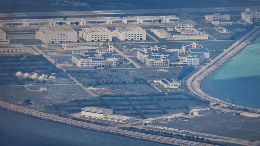 SPRATLY ISLANDS, AT SEA - OCTOBER 25: Buildings and structures are seen on the artificial island built by China in Gaven Reefs on October 25, 2022 in Spratly Islands, South China Sea. China has progressively asserted its claim of ownership over disputed islands in the South China Sea by artificially increasing the size of islands, creating new islands and building ports, military outposts and airstrips. The South China sea is an important trade route and is of significant interest as geopolitical tensions remain high in the region. (Photo by Ezra Acayan/Getty Images)