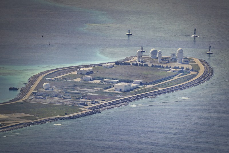 1436864964 SPRATLY ISLANDS, AT SEA - OCTOBER 25: An airfield, buildings, and structures are seen on the artificial island built by China in Subi Reef on October 25, 2022 in Spratly Islands, South China Sea. China has progressively asserted its claim of ownership over disputed islands in the South China Sea by artificially increasing the size of islands, creating new islands and building ports, military outposts and airstrips. The South China sea is an important trade route and is of significant interest as geopolitical tensions remain high in the region. (Photo by Ezra Acayan/Getty Images)
