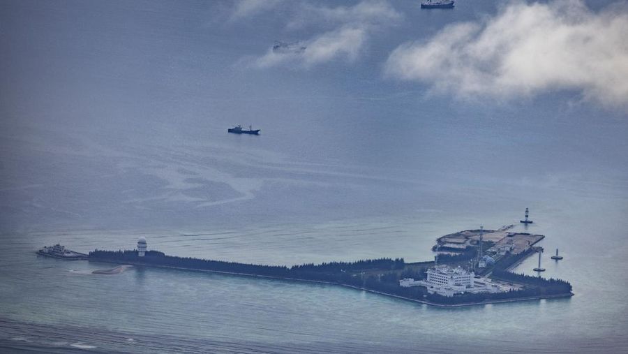 SPRATLY ISLANDS, AT SEA - OCTOBER 25: Buildings and structures are seen on the artificial island built by China in Gaven Reefs on October 25, 2022 in Spratly Islands, South China Sea. China has progressively asserted its claim of ownership over disputed islands in the South China Sea by artificially increasing the size of islands, creating new islands and building ports, military outposts and airstrips. The South China sea is an important trade route and is of significant interest as geopolitical tensions remain high in the region. (Photo by Ezra Acayan/Getty Images)