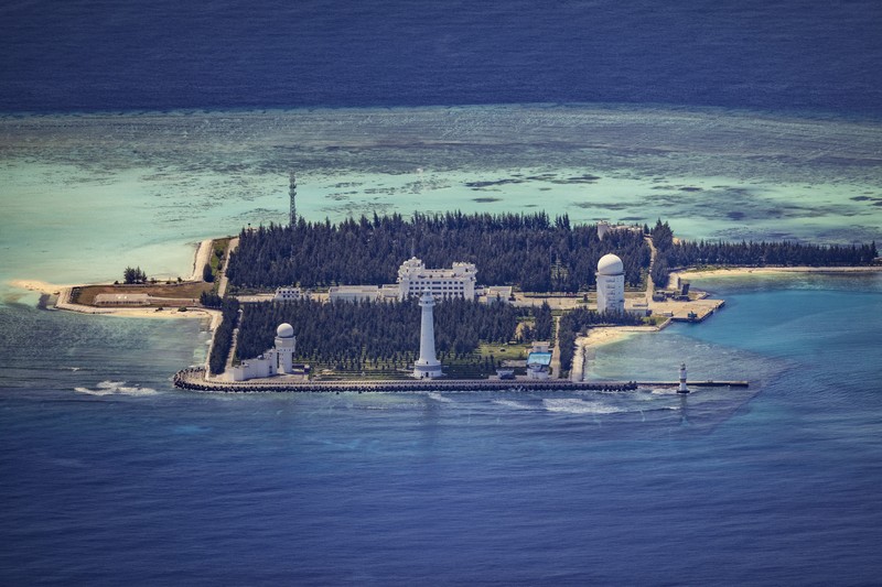 1436864964 SPRATLY ISLANDS, AT SEA - OCTOBER 25: An airfield, buildings, and structures are seen on the artificial island built by China in Subi Reef on October 25, 2022 in Spratly Islands, South China Sea. China has progressively asserted its claim of ownership over disputed islands in the South China Sea by artificially increasing the size of islands, creating new islands and building ports, military outposts and airstrips. The South China sea is an important trade route and is of significant interest as geopolitical tensions remain high in the region. (Photo by Ezra Acayan/Getty Images)