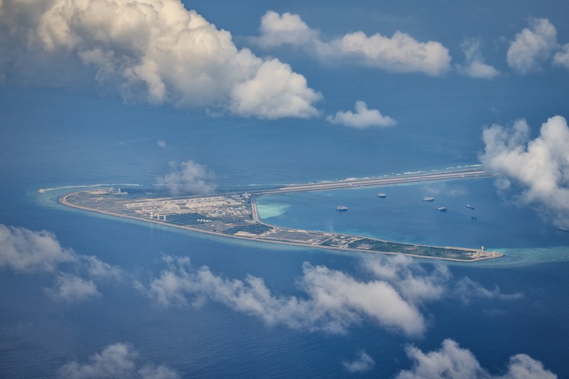 1436864964 SPRATLY ISLANDS, AT SEA - OCTOBER 25: An airfield, buildings, and structures are seen on the artificial island built by China in Subi Reef on October 25, 2022 in Spratly Islands, South China Sea. China has progressively asserted its claim of ownership over disputed islands in the South China Sea by artificially increasing the size of islands, creating new islands and building ports, military outposts and airstrips. The South China sea is an important trade route and is of significant interest as geopolitical tensions remain high in the region. (Photo by Ezra Acayan/Getty Images)