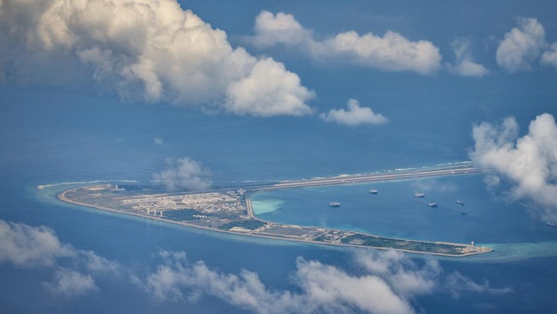 SPRATLY ISLANDS, AT SEA - OCTOBER 25: An airfield, buildings, and structures are seen on the artificial island built by China in Subi Reef on October 25, 2022 in Spratly Islands, South China Sea. China has progressively asserted its claim of ownership over disputed islands in the South China Sea by artificially increasing the size of islands, creating new islands and building ports, military outposts and airstrips. The South China sea is an important trade route and is of significant interest as geopolitical tensions remain high in the region. (Photo by Ezra Acayan/Getty Images)